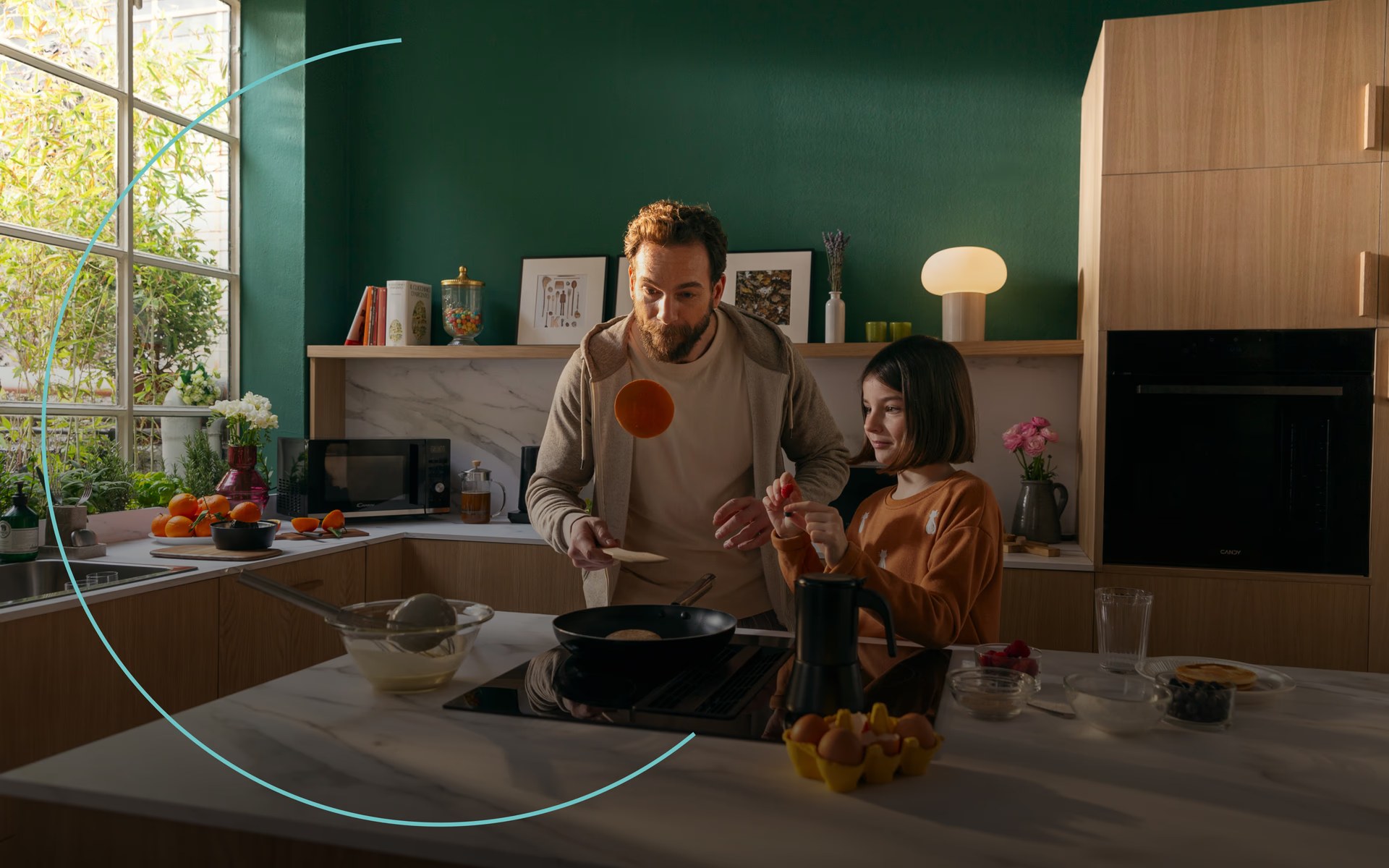 Family cooking together in a kitchen with Candy appliances