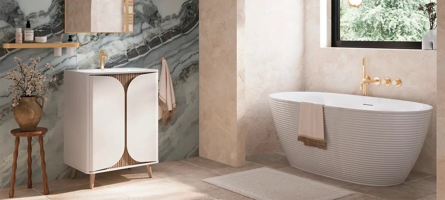 Crosswater freestanding bath beside a white vanity unit in a bright bathroom