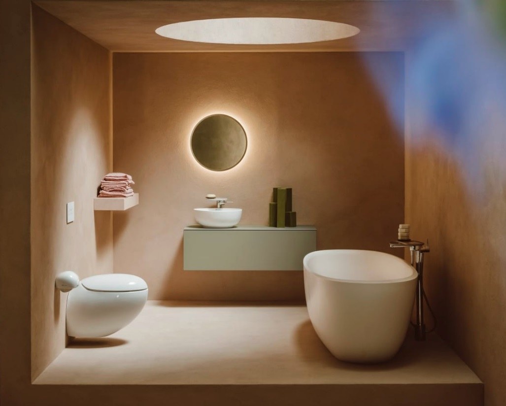Laufen bathroom with illuminated round mirror and wall hung toilet