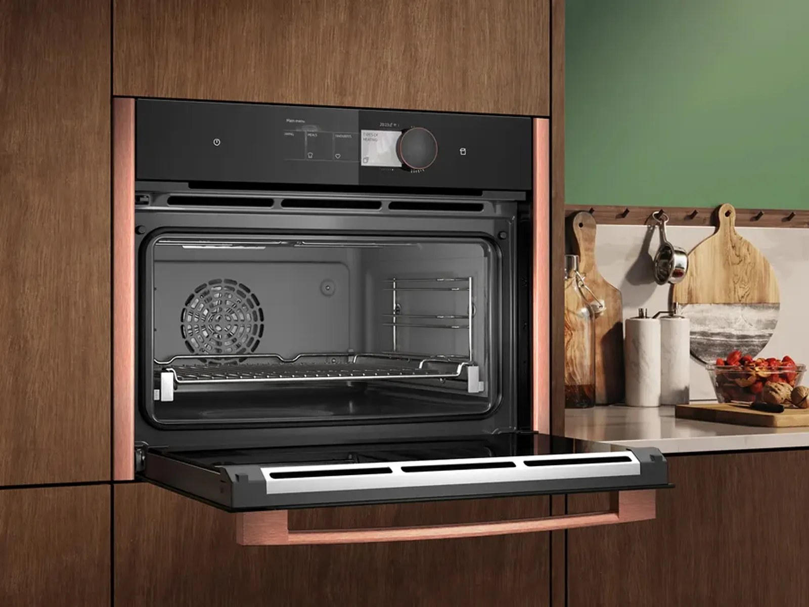 Neff compact oven with copper trim in a wood kitchen