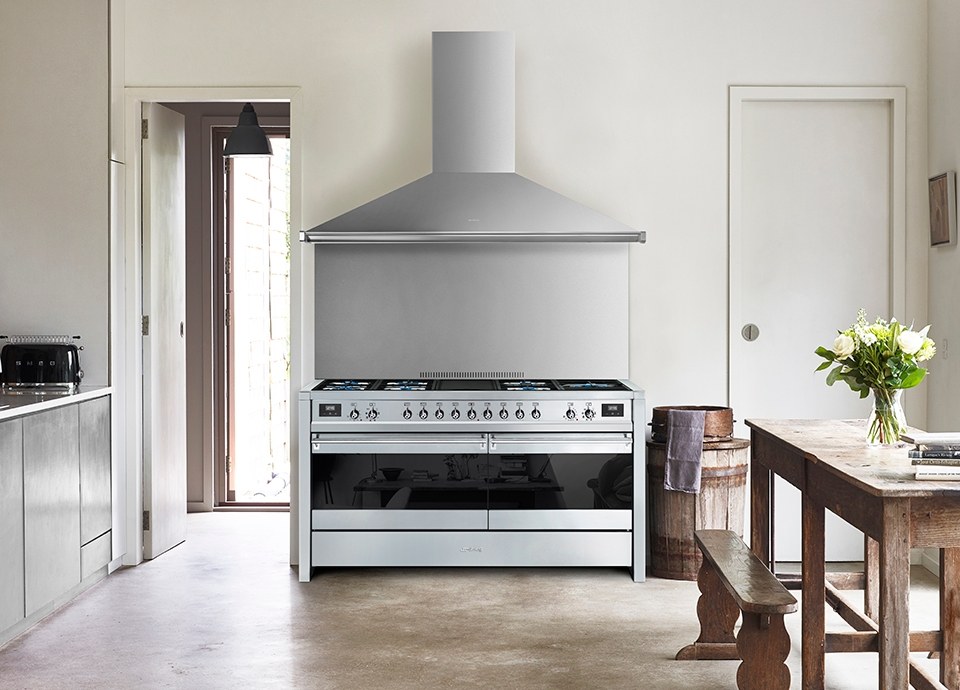 Smeg range cooker with a stainless steel cooker hood